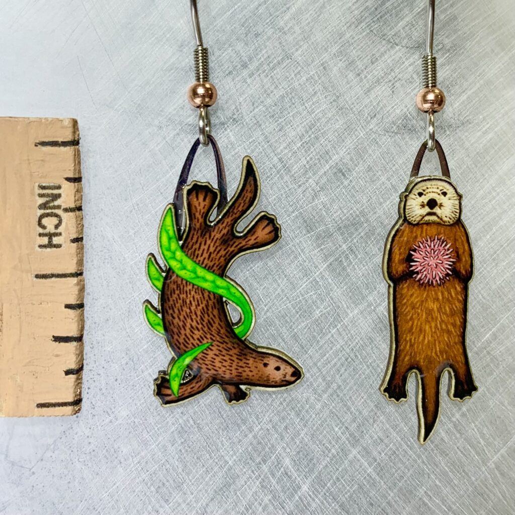 Picture shown is of 1 inch tall pair of earrings of the marine animal the Sea Otter.