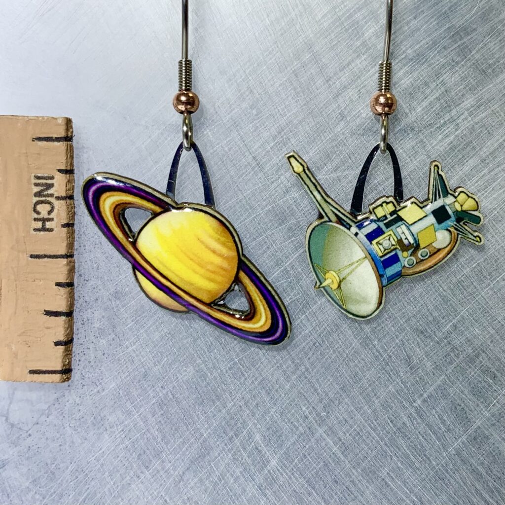 Picture shown is of 1 inch tall pair of earrings of Cassini & Saturn.