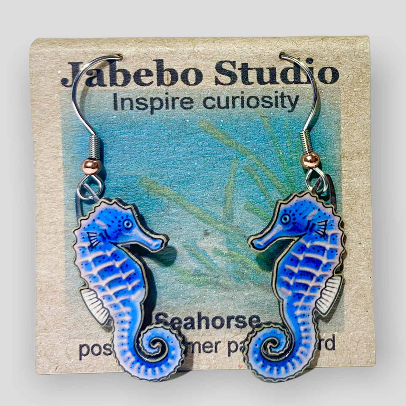 Picture shown is of 1 inch tall pair of earrings of the marine animal the Blue Seahorse.