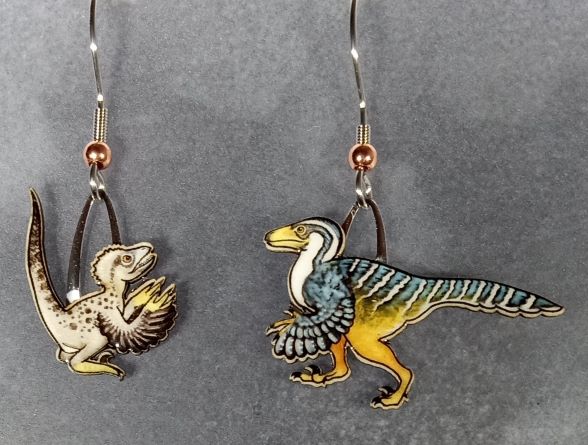 Picture shown is of 1 inch tall pair of earrings of the dinosaur the Velociraptor.